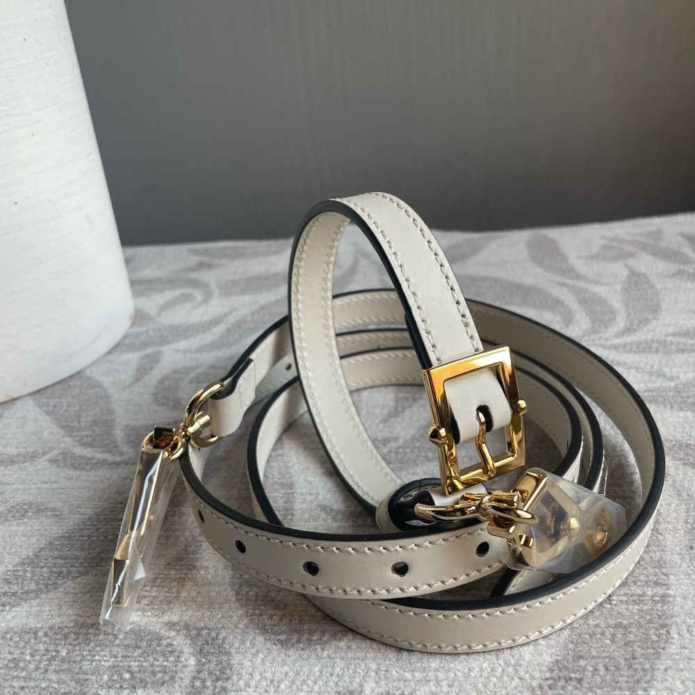 Gucci White Leather Strap with Gold Accents